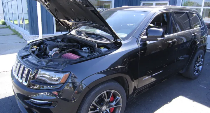 Black SUV with open hood