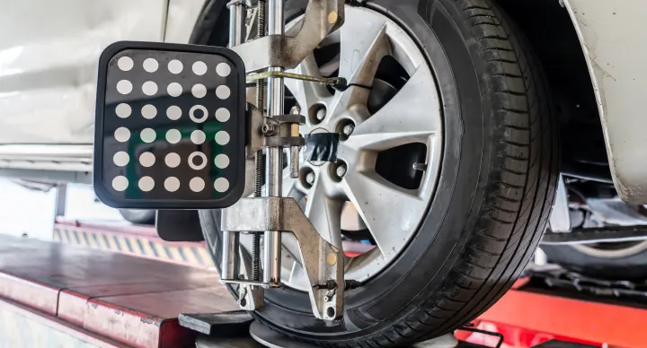 Wheel Alignment In Grand Blanc Township, MI At Grand Pointe Automotive. Vehicle wheel alignment equipment in use