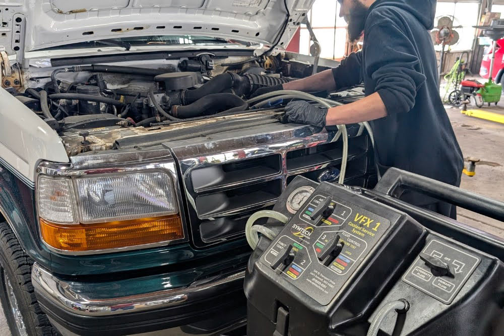 Man doing Coolant Flush Service